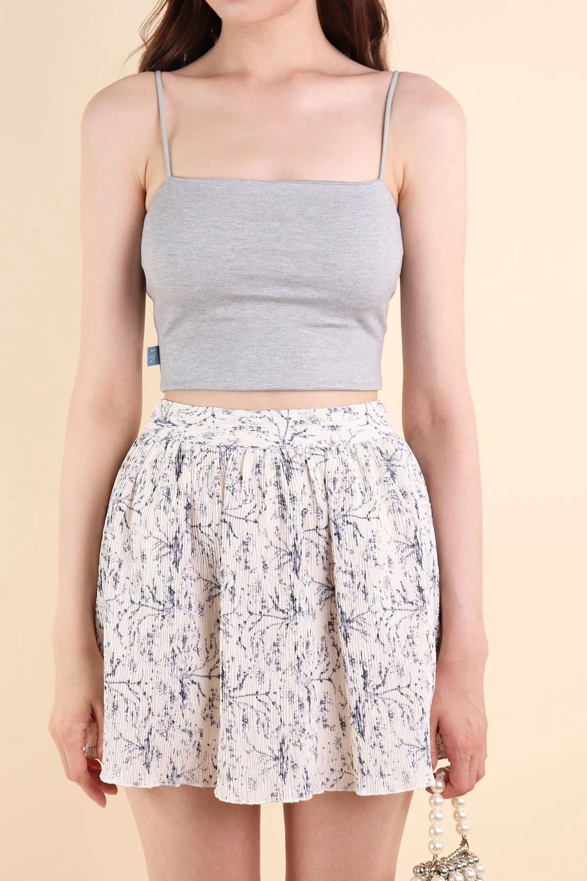 FREESIA FLORAL PLEATED SKORTS IN PORCELAIN